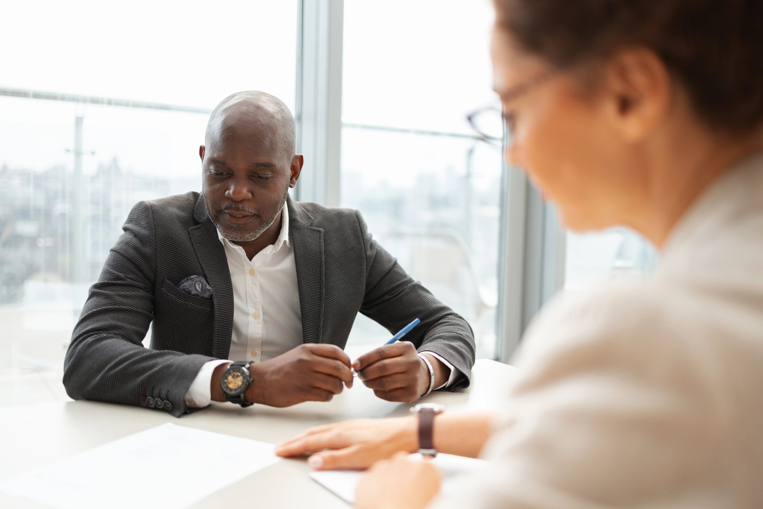Professionals discussing a business transaction